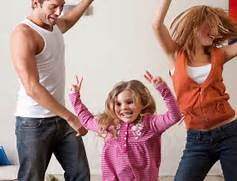 parents and toddler dancing
